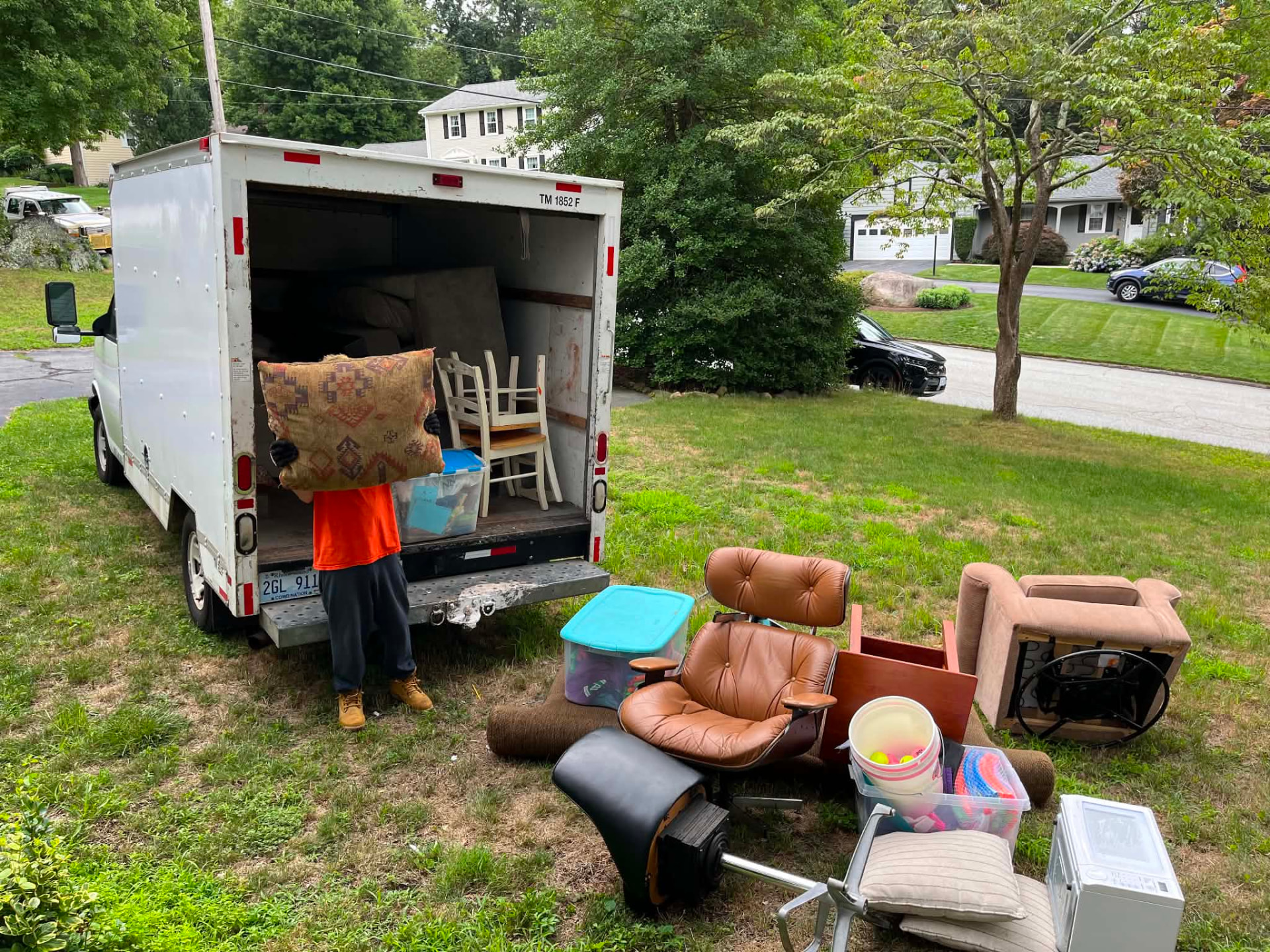 Severely cluttered bathroom before an Unstoppable Junk Removal cleanout in Rhode Island